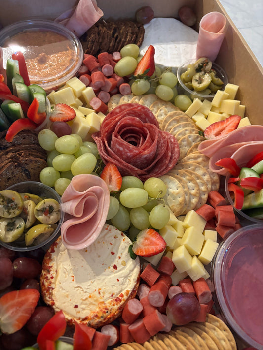 Donut Bouquet Canberra grazing box filled with assorted cheeses, sliced meats, crackers, fresh fruit, and dips.