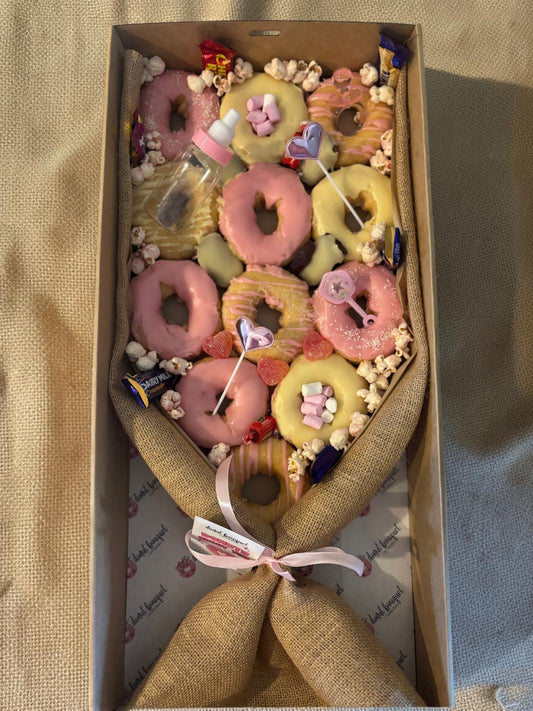 Donut Bouquet Canberra large gluten-free baby girl gift box with pink and yellow iced donuts, lollies, and popcorn.
