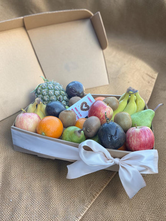 Donut Bouquet Canberra fresh fruit gift hamper featuring assorted seasonal fruits like apples, pears, and pineapple.