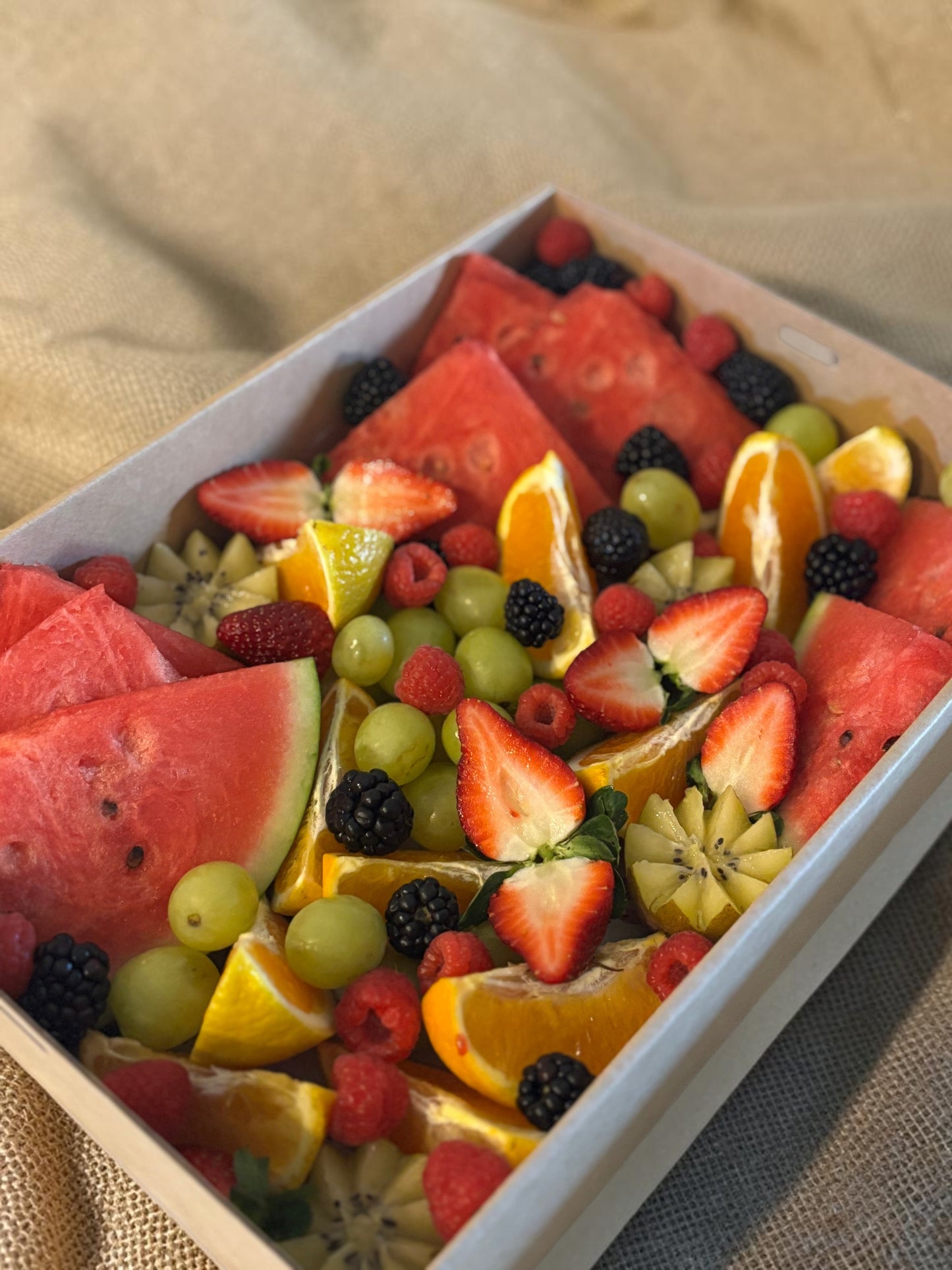 Donut Bouquet Canberra fruit grazing box filled with fresh watermelon, strawberries, blackberries, and grapes and seasonal fruit.