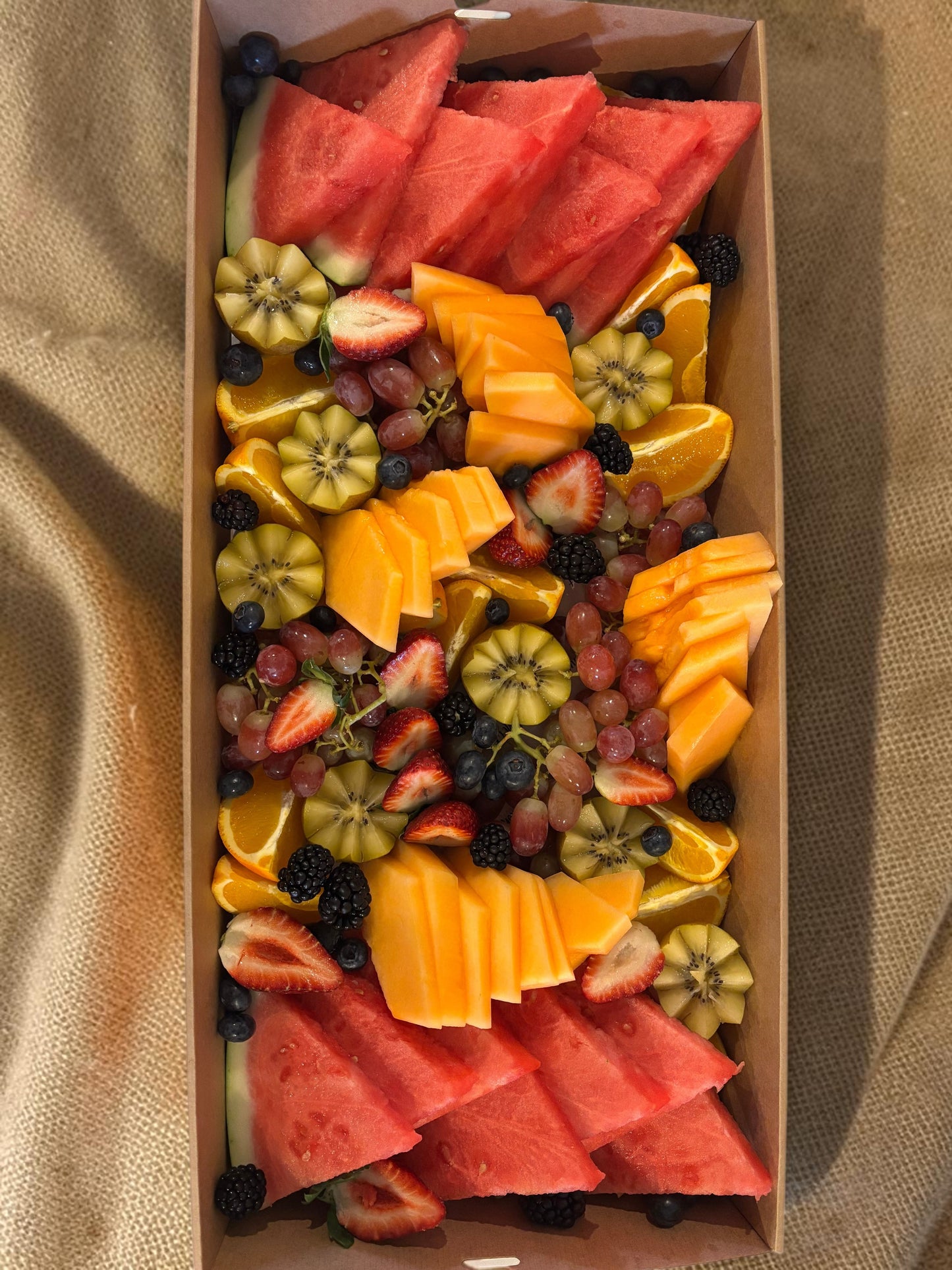 Donut Bouquet Canberra fruit grazing box filled with fresh watermelon, strawberries, blackberries, and grapes and seasonal fruit.