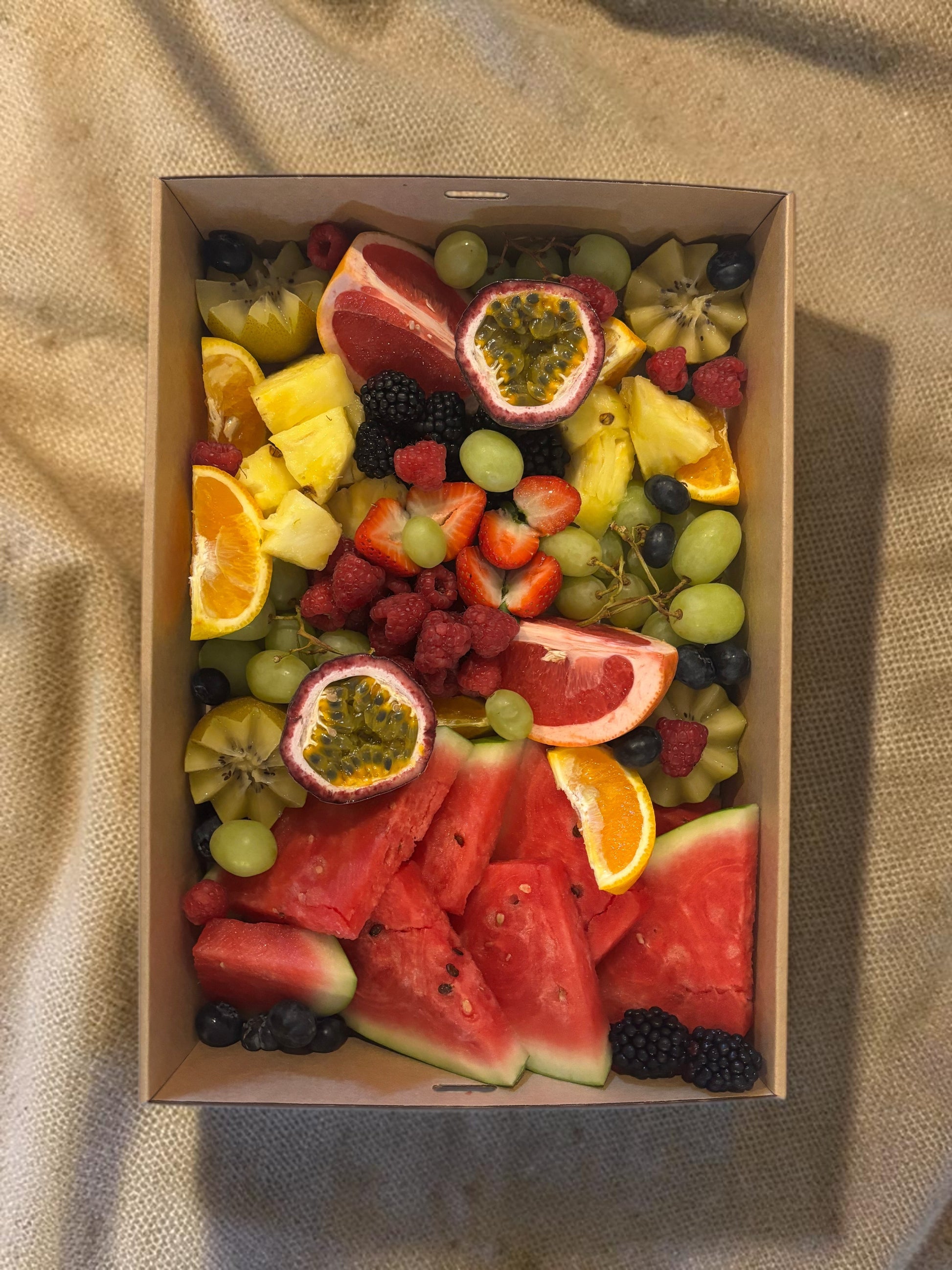 Donut Bouquet Canberra fruit grazing box filled with fresh watermelon, strawberries, blackberries, and grapes and seasonal fruit.