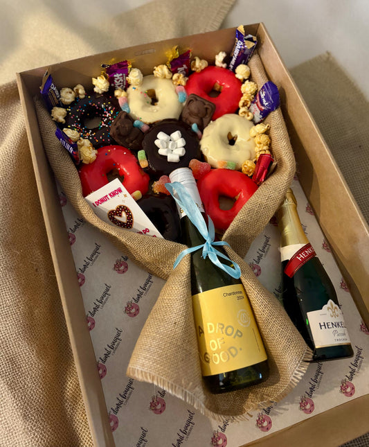 Donut Bouquet Canberra gluten free donut bouquet with assorted chocolates, lollies, and wine in a burlap gift box.