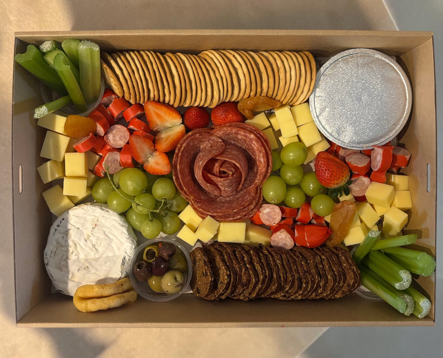 Donut Bouquet Canberra grazing box featuring salami rose, assorted cheeses, crackers, fresh fruit, and veggie sticks.