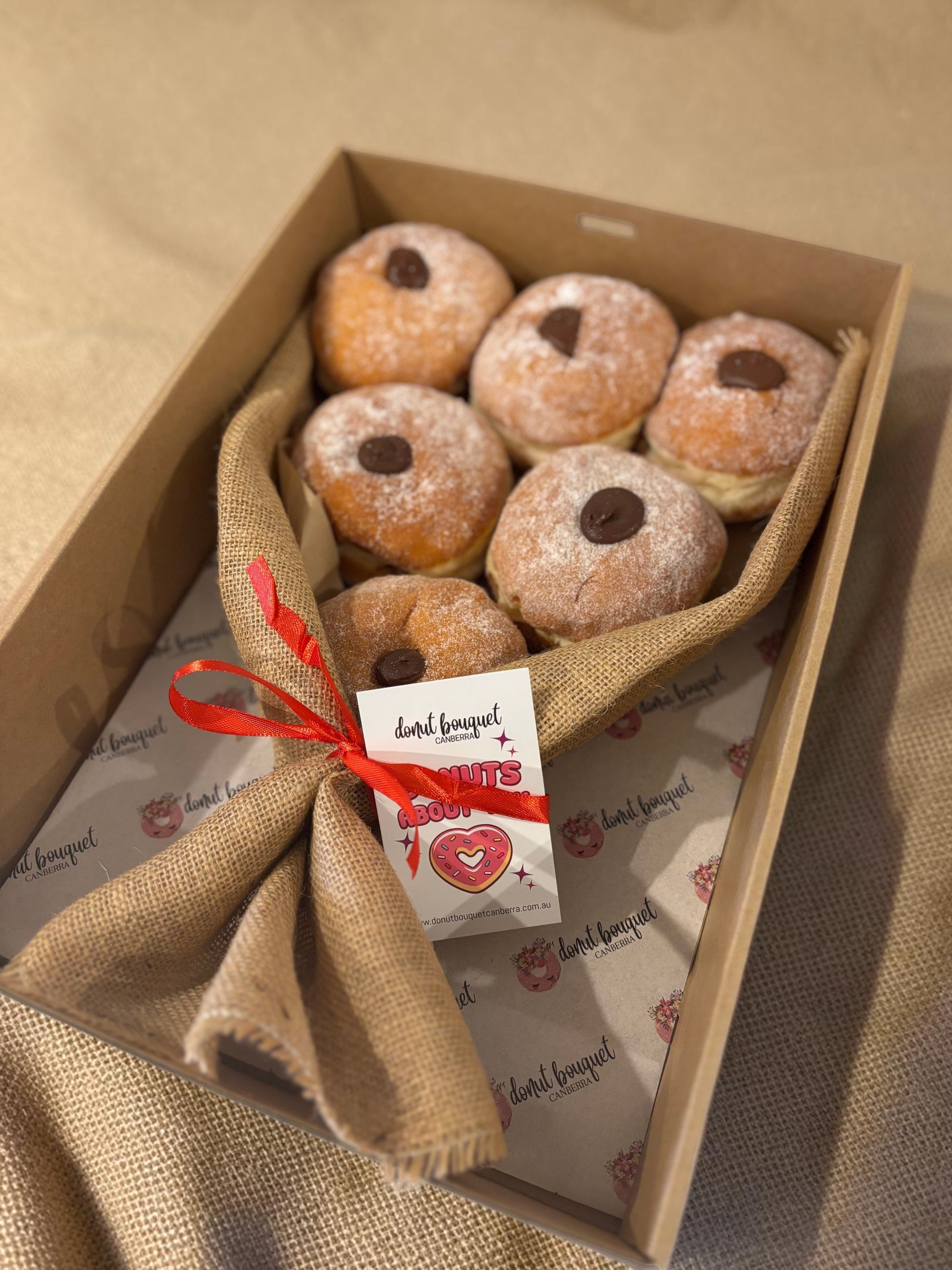 Donut Bouquet Canberra 6 pack Nutella donuts wrapped in rustic hessian with a ribbon in a gift box