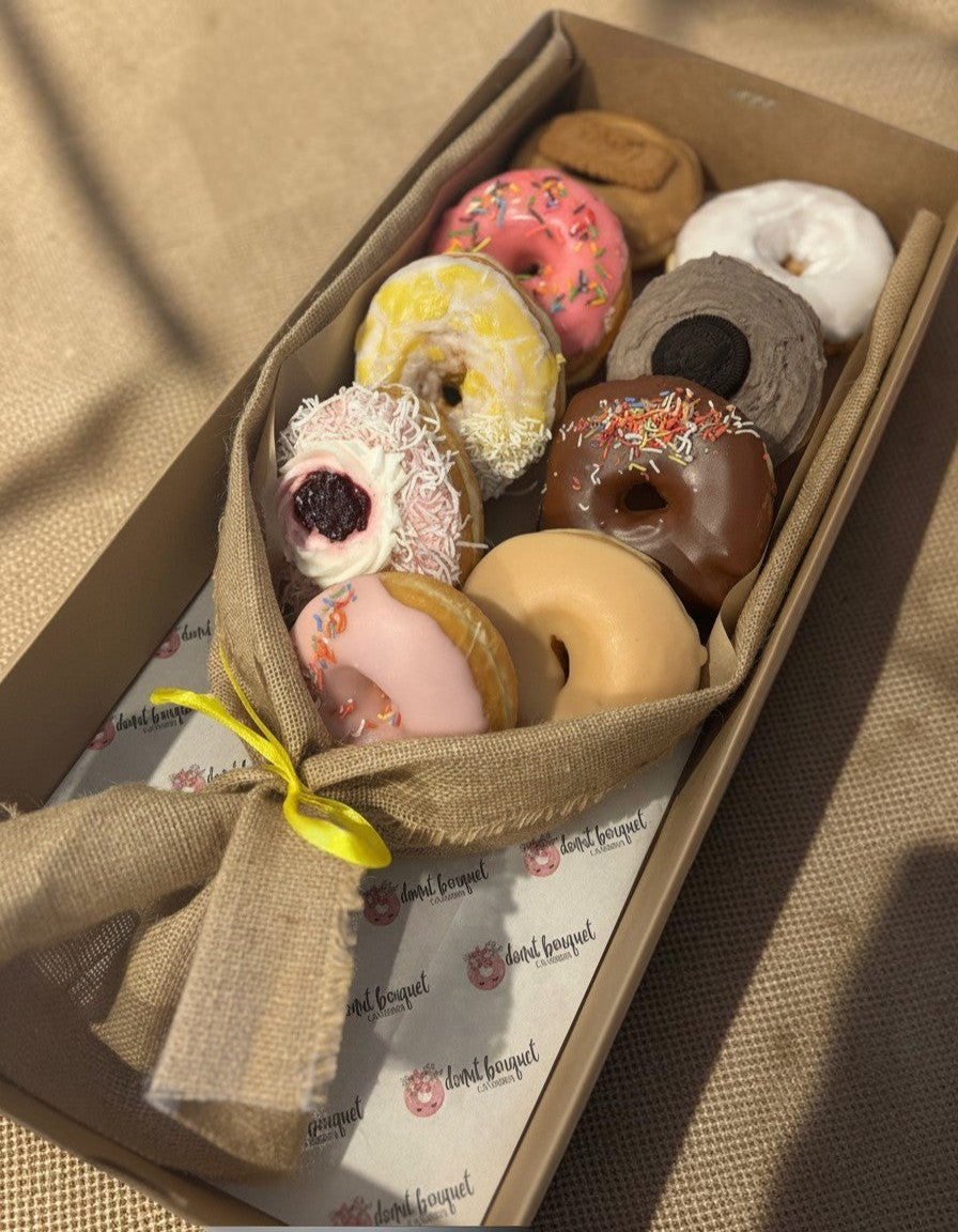 Donut Bouquet Canberra vegan donut bouquet featuring nine assorted glazed and topped donuts in a burlap wrap.