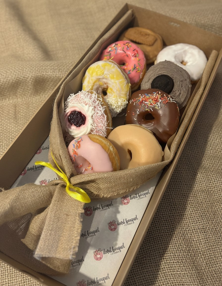 Donut Bouquet Canberra vegan donut bouquet featuring nine assorted XL donuts wrapped in hessian with a yellow ribbon