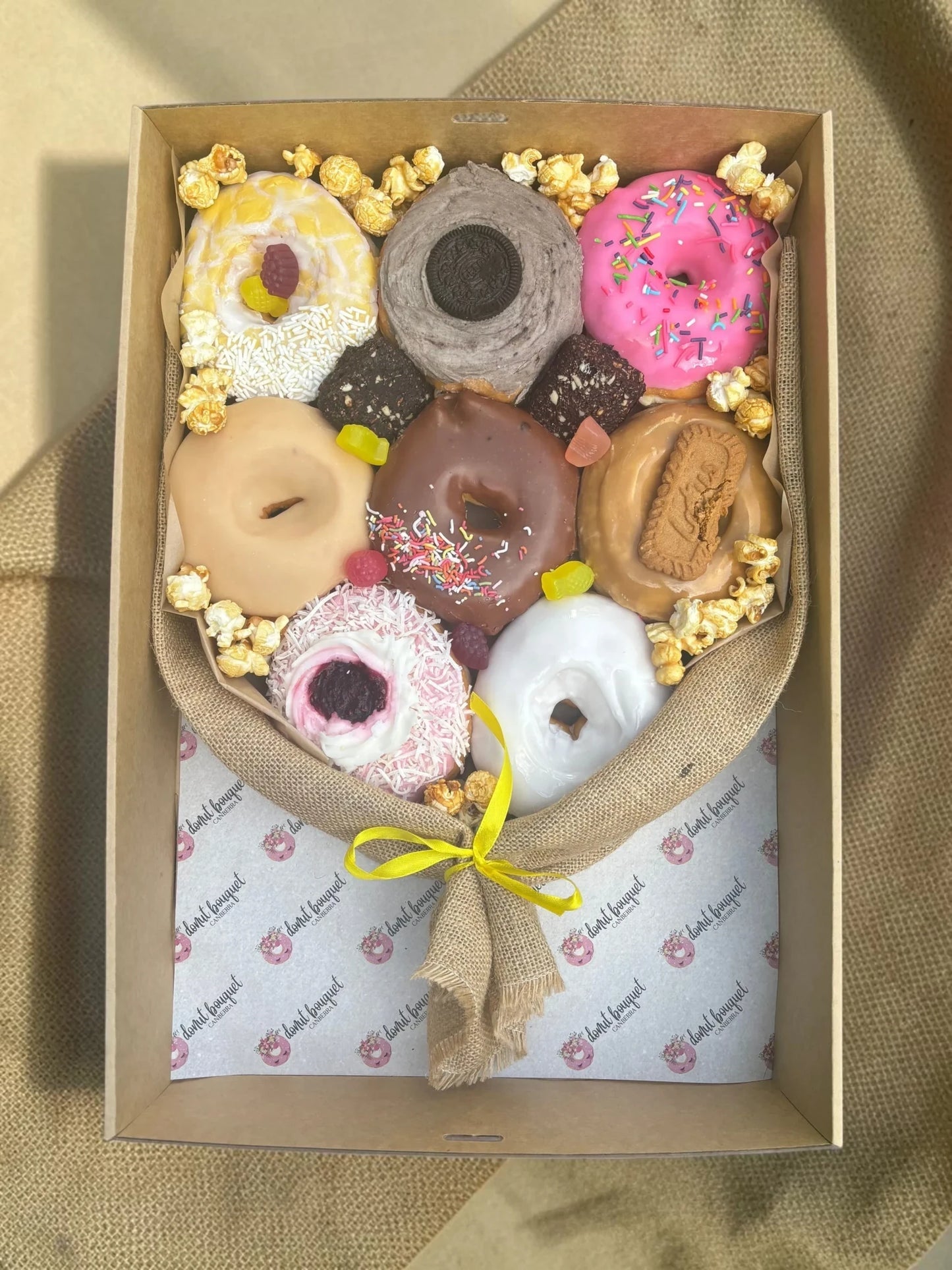 Donut Bouquet Canberra vegan donut bouquet gift box with assorted glazed donuts, brownies, popcorn, and lollies.