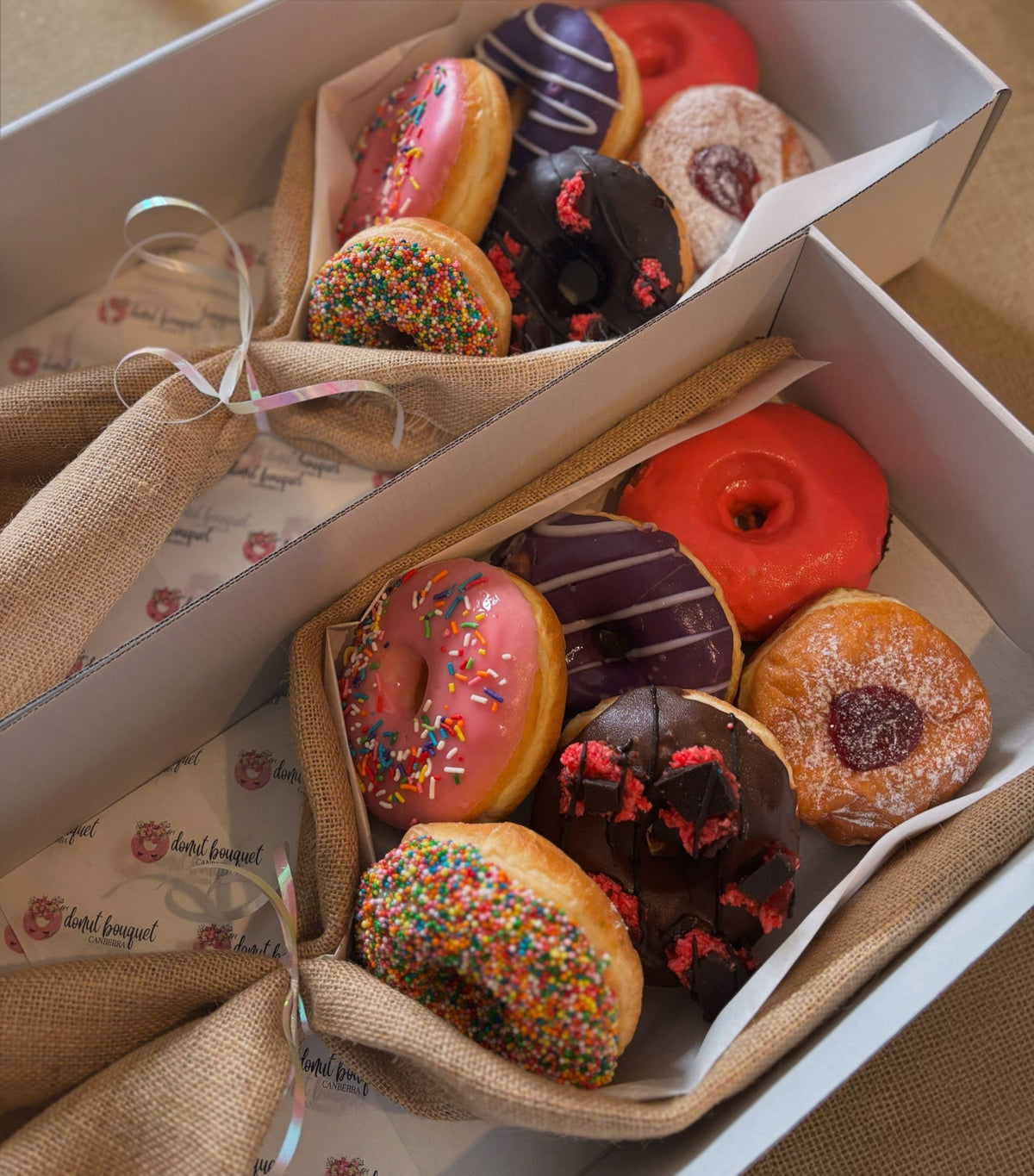 Donut Bouquet Canberra premium 6 pack XL donut bouquet featuring assorted glazed, sprinkled, and filled donuts.