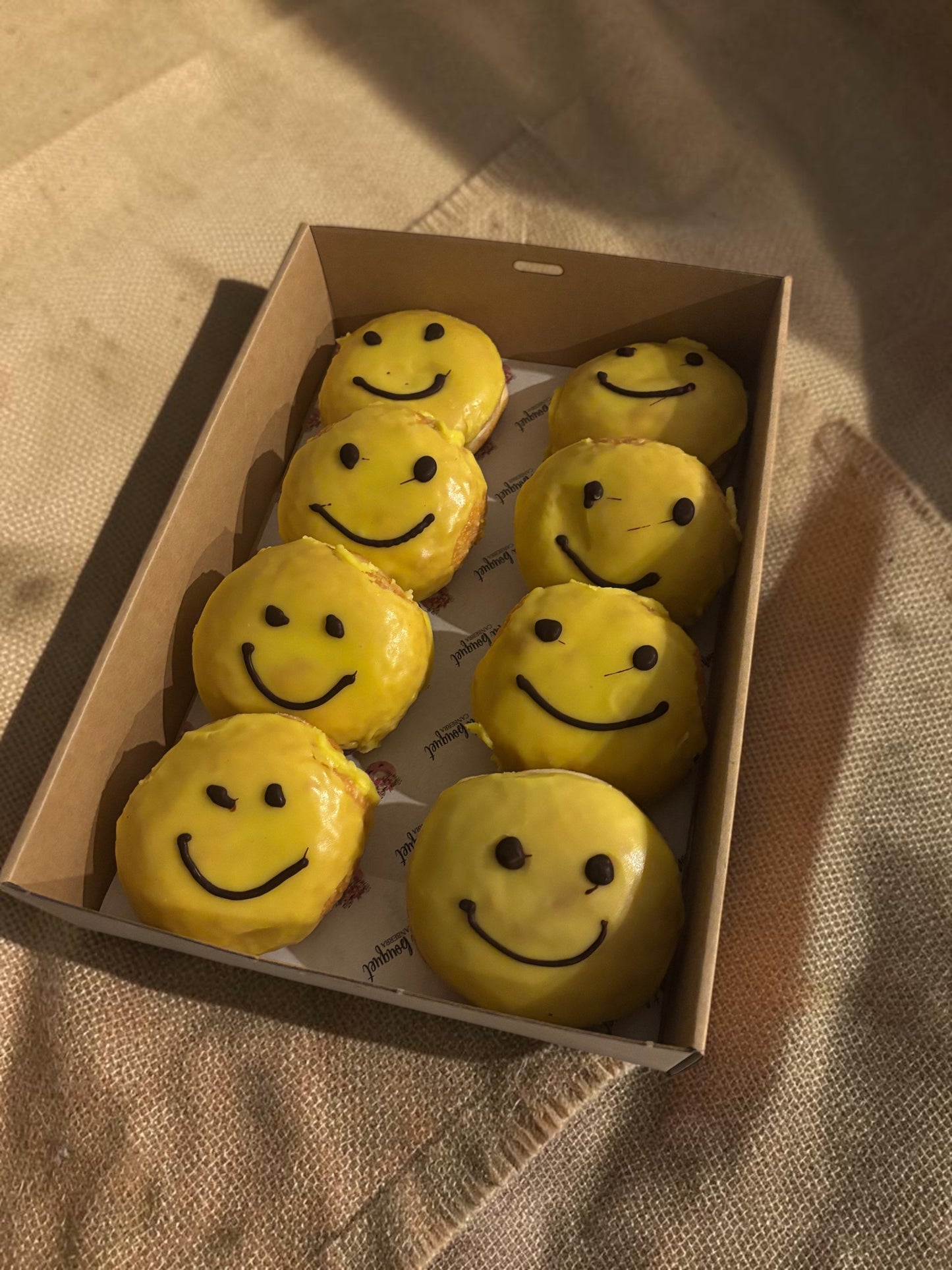Donut Bouquet Canberra box of yellow smiley face donuts for R U OK Day with chocolate icing smiles